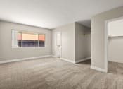 Thumbnail 18 of 38 - an empty bedroom with a large window