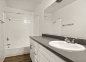 Thumbnail 21 of 38 - a bathroom with a sink and a shower
