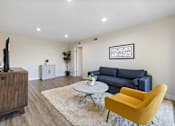 Thumbnail 2 of 69 - Living Room With TV at Lombardi Apartments, California, 91367