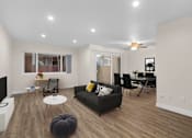 Thumbnail 31 of 69 - a living room with a couch and a table at Lombardi Apartments, Woodland Hills, CA