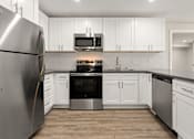 Thumbnail 25 of 54 - Kitchen Appliances at Woodland Trio Apartments, California