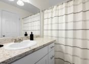 Thumbnail 7 of 60 - Bathroom along with curtain at The Meadows at Westlake Village Apartments,California, 91361