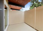 Thumbnail 34 of 60 - a porch with a fence and a blue sky in the background  at The Meadows at Westlake Village Apartments, CA, 91361
