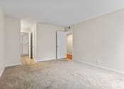 Thumbnail 35 of 60 - a bedroom with white walls and a carpeted floor at The Meadows at Westlake Village Apartments, Westlake Village, CA