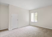 Thumbnail 39 of 60 - a bedroom with white walls and carpet at The Meadows at Westlake Village Apartments, Westlake Village, CA 91361