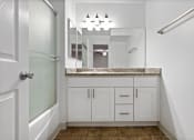 Thumbnail 36 of 60 - a bathroom with a sink and a mirror at The Meadows at The Meadows at Westlake Village Apartments, Westlake Village, CA