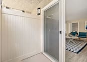 Thumbnail 7 of 60 - an open door leading to a living room with a couch and coffee table in the background at Casa De Marina Apartments, Los Angeles, CA 90066
