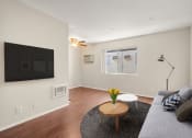 Thumbnail 2 of 41 - A living room with a couch and a coffee table