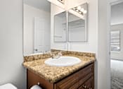 Thumbnail 46 of 54 - a bathroom with a sink and a mirror at Woodland Trio Apartments, California, 91601