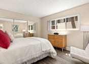 Thumbnail 9 of 60 - Bedroom Featuring Mirrored Sliding Closet Doors & Chic Furniture at Casa De Marina Apartments, Los Angeles, 90066