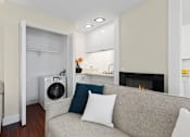 Thumbnail 17 of 60 - Living Room with Fireplace, Washer/Dryer, and Grey Couch at Casa De Marina Apartments, Los Angeles, California
