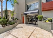 Thumbnail 50 of 54 - Building Exterior Entrance Doors at Woodland Trio Apartments, North Hollywood, CA, 91601
