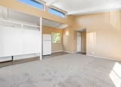 Thumbnail 6 of 15 - Living Room with Vaulted Ceilings and skylights.