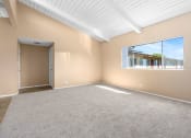 Thumbnail 7 of 15 - Carpeted Living Room at St. Andrews Apartmens