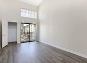 Thumbnail 20 of 40 - Living Room with Balcony and Wood Floors