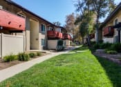 Thumbnail 30 of 60 - Walkway and Lush Greenery at The Meadows at Westlake Village Apartments,Westlake Village