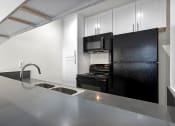 Thumbnail 14 of 41 - Topanga Apartments Kitchen with Updated Cabinets and Countertops