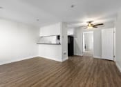 Thumbnail 11 of 41 - Apartments In West Hills, CA For Rent - Topanga Canyon - Living Room With Hardwood Floors, Ceiling Fan, And Direct Kitchen Access