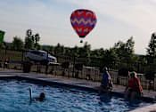 Thumbnail 2 of 25 - A view from the pool at Abbey Ridge Apartment Homes, Michigan