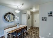 Thumbnail 24 of 25 - A dining room with a wooden table and chairs at Abbey Ridge Apartment Homes, Oxford