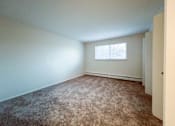 Thumbnail 32 of 33 - an empty room with carpet and a window