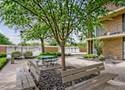 Thumbnail 5 of 30 - A tree with a green leaf is in the center of the image at Independence Place Apartments, Parma Heights, OH 44130