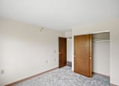 Thumbnail 28 of 30 - A room with a carpeted floor and a white ceiling at Independence Place Apartments, Parma Heights, OH 44130