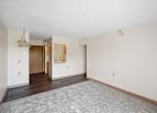 Thumbnail 22 of 30 - A room with a grey carpet and white walls at Independence Place Apartments, Parma Heights, 44130