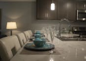 Thumbnail 50 of 75 - a long kitchen table with white chairs and a sink at The Crossings at Redlands, Redlands, 92374