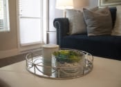 Thumbnail 47 of 75 - a coffee table with a tray and a candle on it at The Crossings at Redlands, Redlands, CA