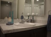Thumbnail 16 of 75 - a bathroom with a sink and a mirror at The Crossings at Redlands, Redlands, CA