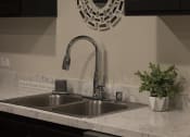 Thumbnail 36 of 75 - a kitchen sink with a chrome faucet at The Crossings at Redlands, California