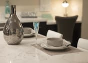 Thumbnail 46 of 75 - a table with a vase and plates on it at The Crossings at Redlands, Redlands, California