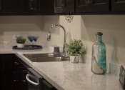Thumbnail 68 of 75 - a kitchen with a sink and a window