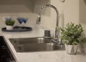 Thumbnail 66 of 75 - a kitchen sink with a plant next to it at The Crossings at Redlands, California