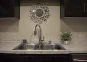 Thumbnail 13 of 75 - a kitchen sink with a mirror above it at The Crossings at Redlands, California 