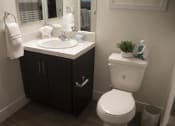 Thumbnail 48 of 75 - a small bathroom with a toilet sink and mirror at The Crossings at Redlands, California