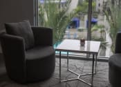 Thumbnail 4 of 75 - a chair and a coffee table in front of a window at The Crossings at Redlands, California, 92374