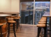 Thumbnail 8 of 75 - a bar with stools and a window with a view at The Crossings at Redlands, Redlands, California