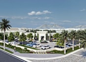 Thumbnail 2 of 12 - an aerial view of a parking lot with palm trees