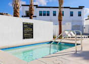 Thumbnail 9 of 12 - A pool with a sign that says spa rules.