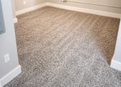 Thumbnail 17 of 17 - A room with a carpeted floor and white walls.