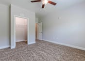Thumbnail 4 of 10 - A room with a ceiling fan and carpeted floor. at Killian Terrace Apartments, Columbia, South Carolina