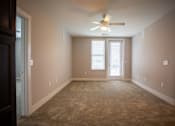 Thumbnail 9 of 13 - Living Room with Patio Access at Stone Springs Apartments, Sterling, VA