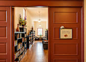 Thumbnail 2 of 9 - A room with a book nook in the middle.