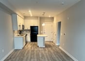 Thumbnail 14 of 33 - Living Room Come Kitchen View at Poland Hill Senior Apartments, Chantilly