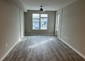 Thumbnail 13 of 33 - Living Room With Expansive Window at Poland Hill Senior Apartments, Chantilly, 20152