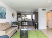 Thumbnail 12 of 60 - Living room and kitchen at The Regency Apartments in Tempe AZ