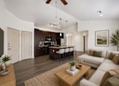 Thumbnail 4 of 27 - A modern living room with a kitchen in the background.