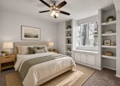 Thumbnail 6 of 23 - A bedroom with a bed, nightstands, and a ceiling fan.
